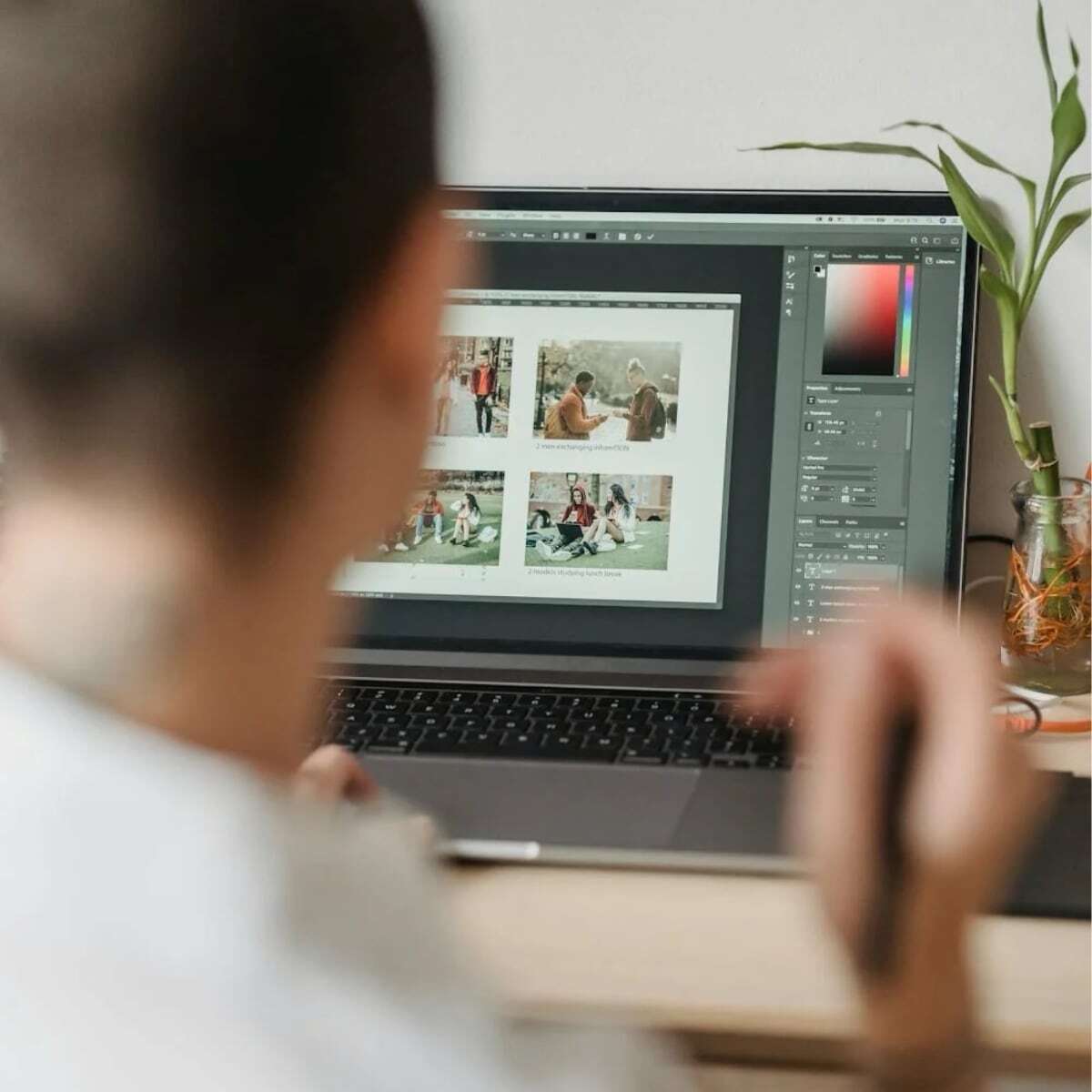 Person reviewing photos on  laptop
